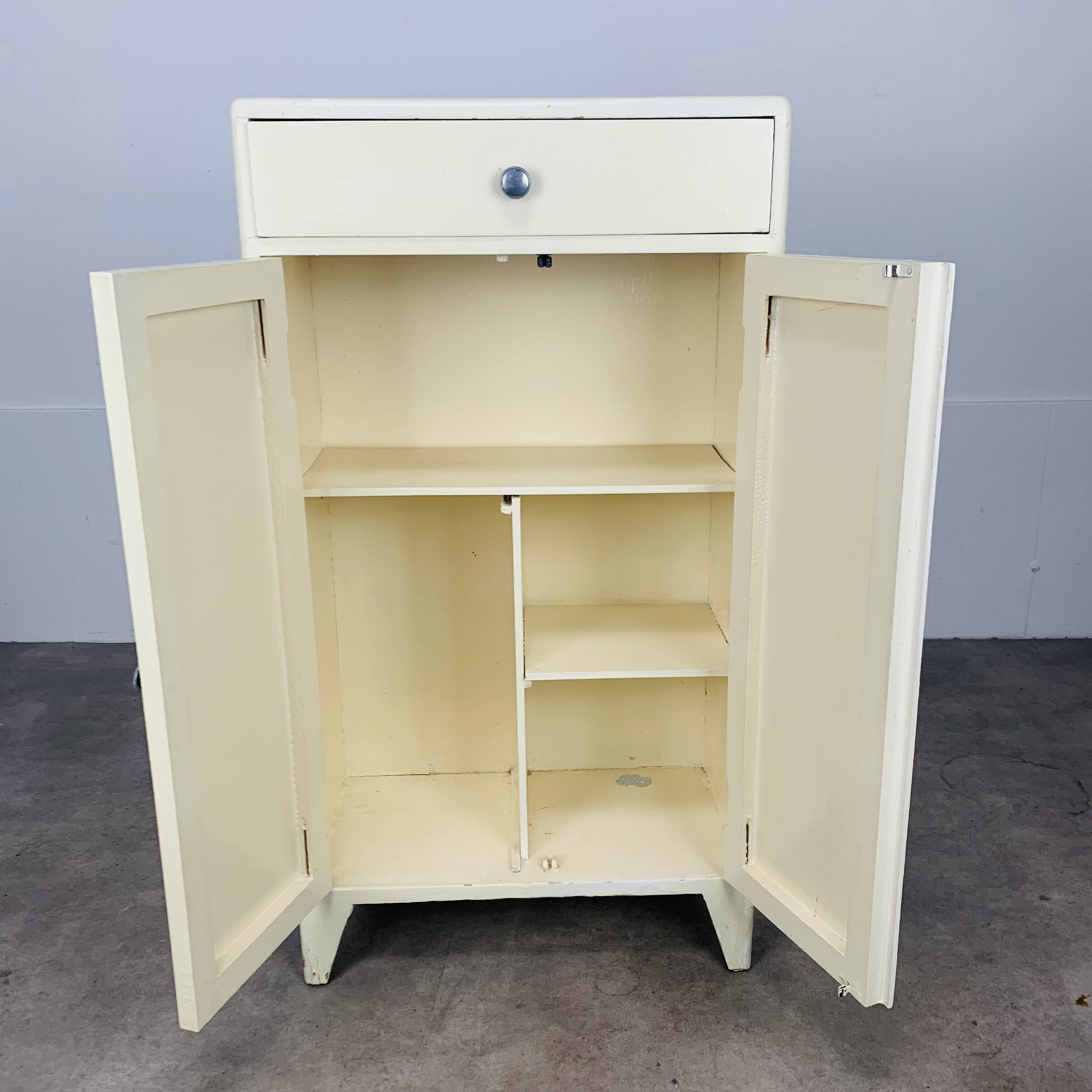White wood convenient storage unit from the 1950s