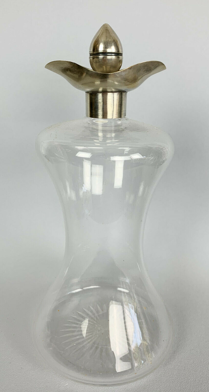 Blown glass carafe with silver frame and cap