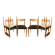 Set of 6 modernist chairs with black faux leather seats.