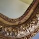 Miroir Louis-Philippe en bois et stuc doré à décor floral, XIXe,  43x38 cm