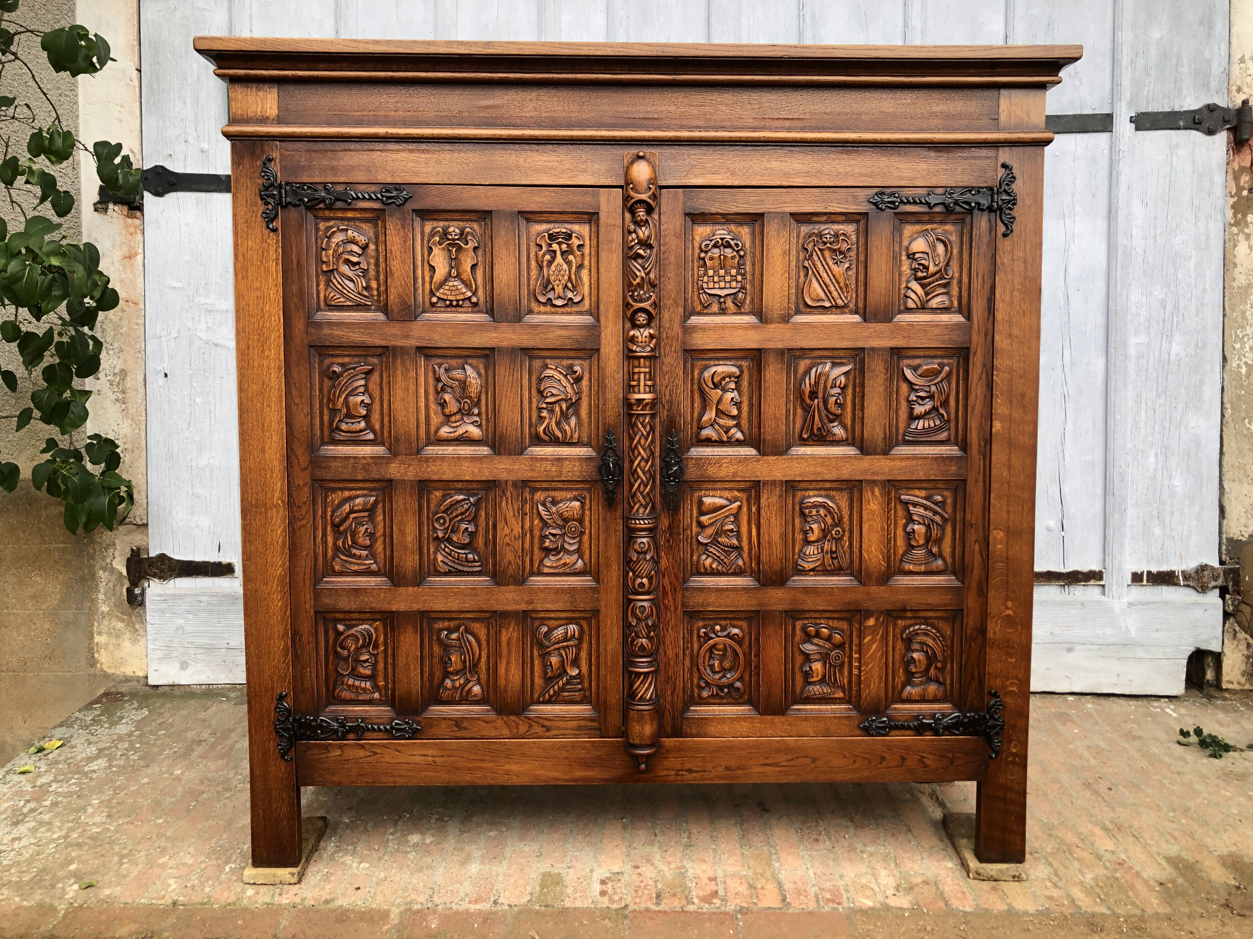 Spanish furniture with carved wood profiles and coats of arms from the 1950s.