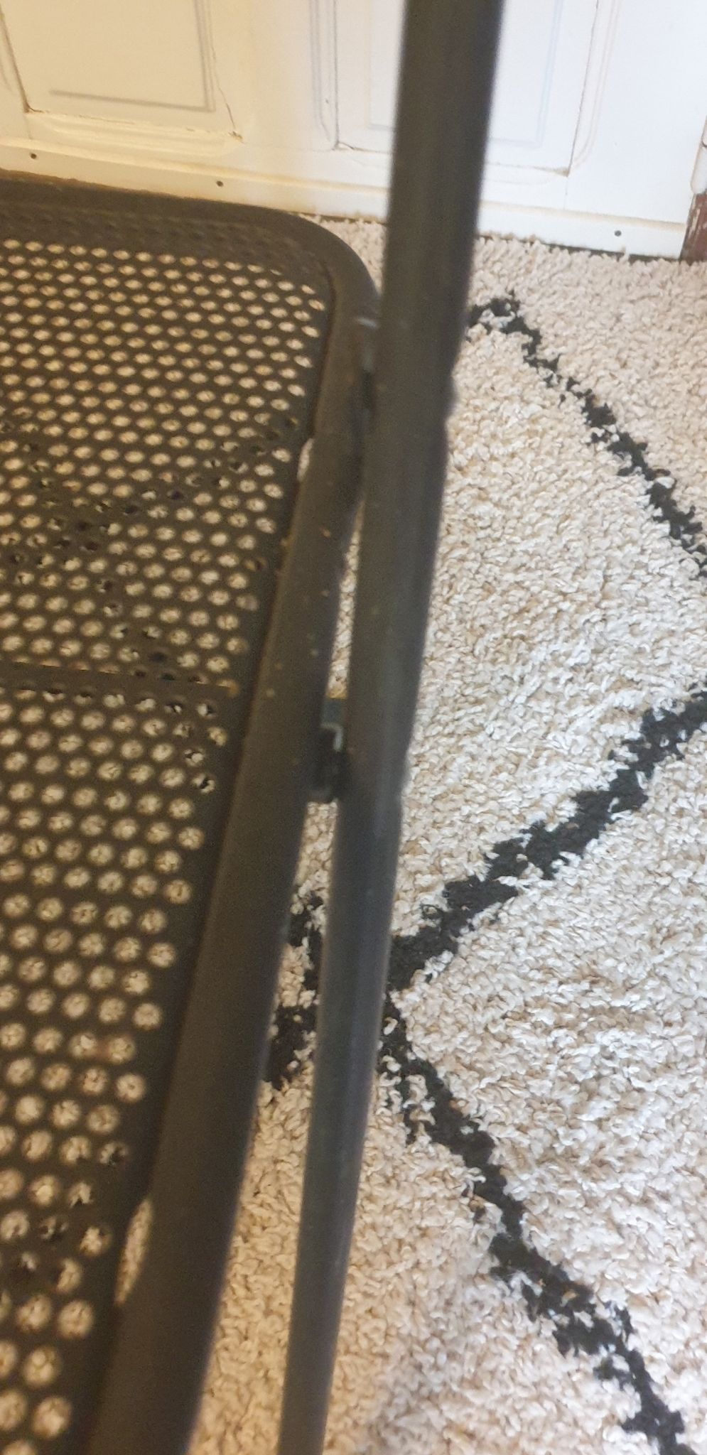Pair of folding chairs in perforated metal
