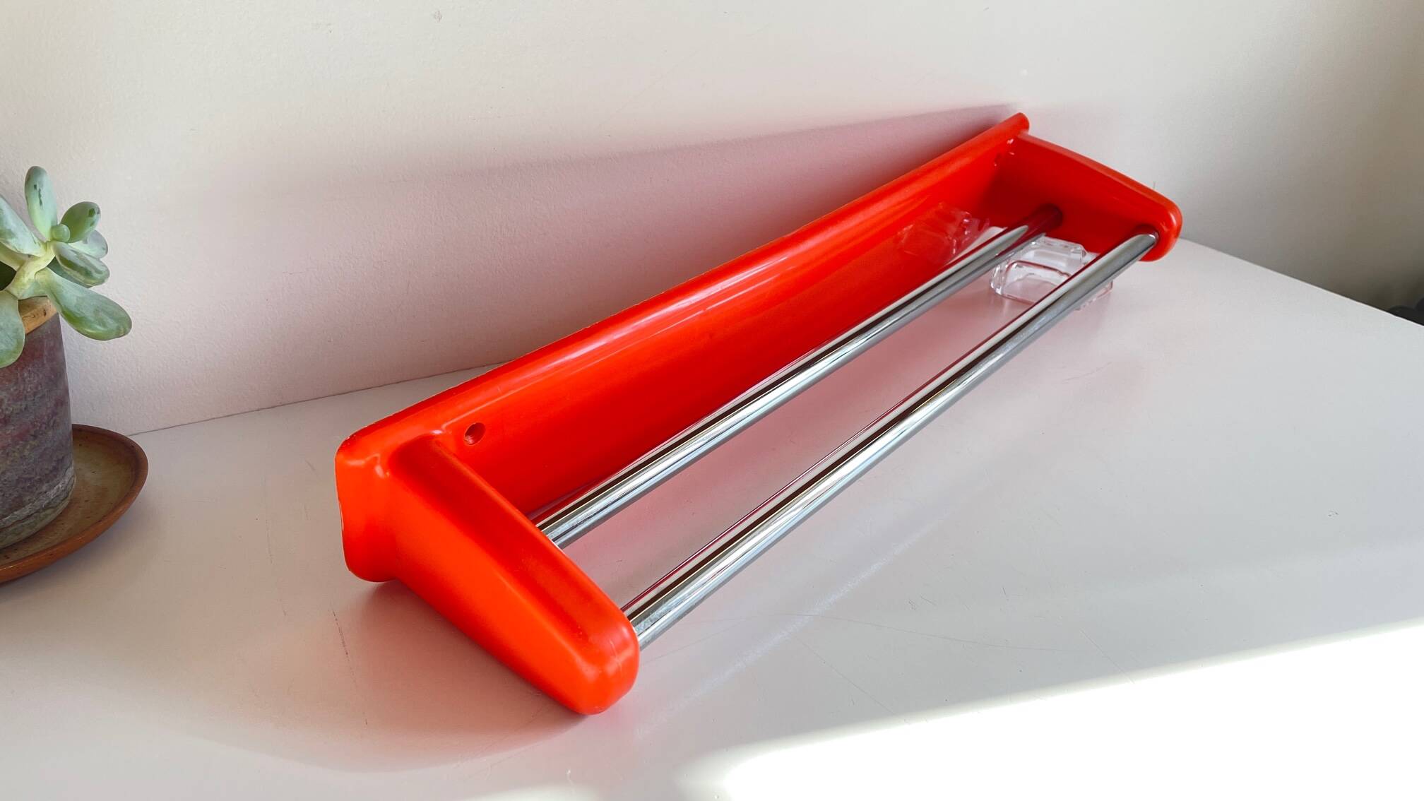 Orange towel rack by Syla from the 70s