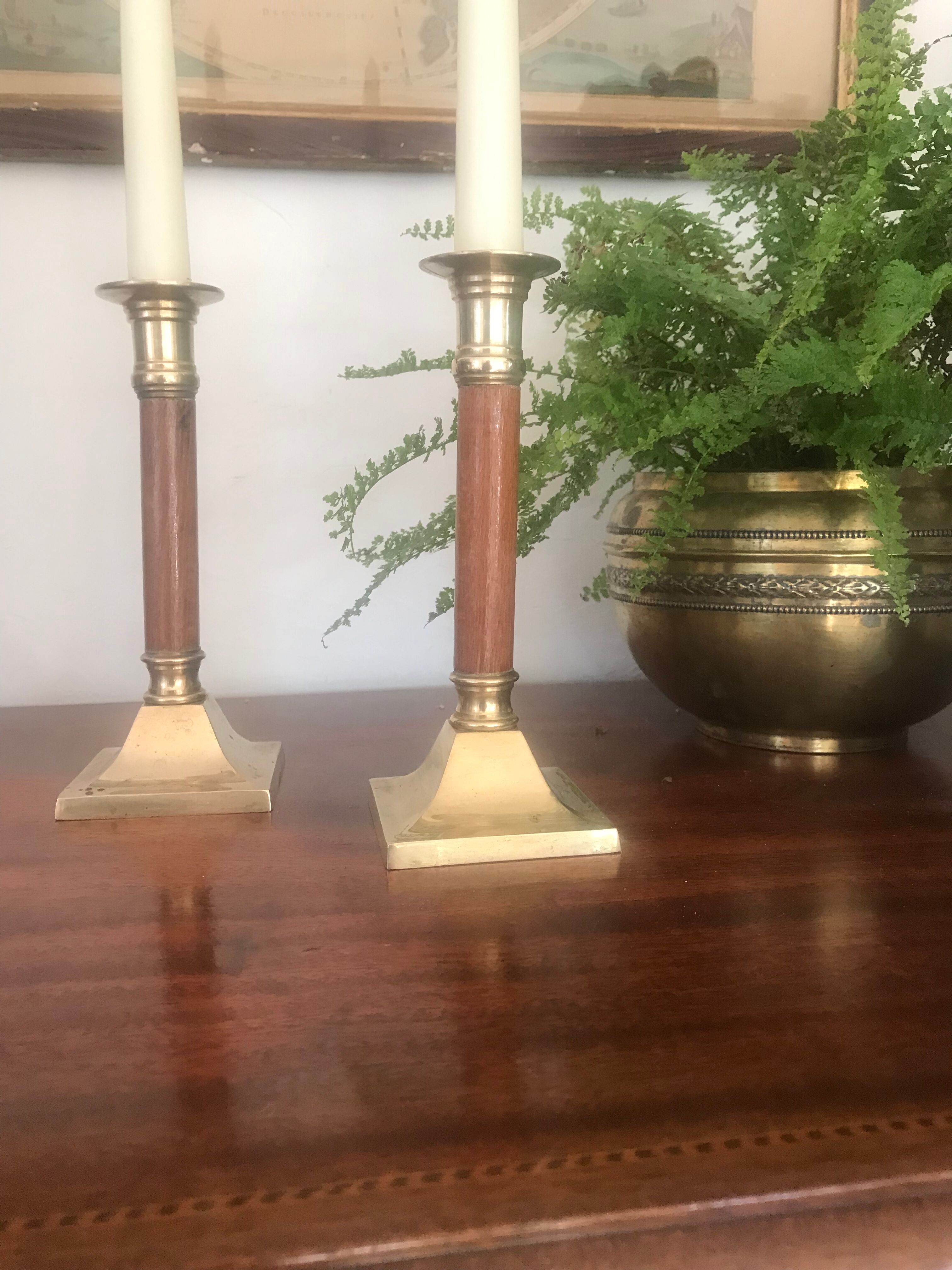 Pair of wood and brass candle holders