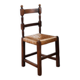 6 rustic oak chairs with rush seats, in the style of Charles Dudouyt.
