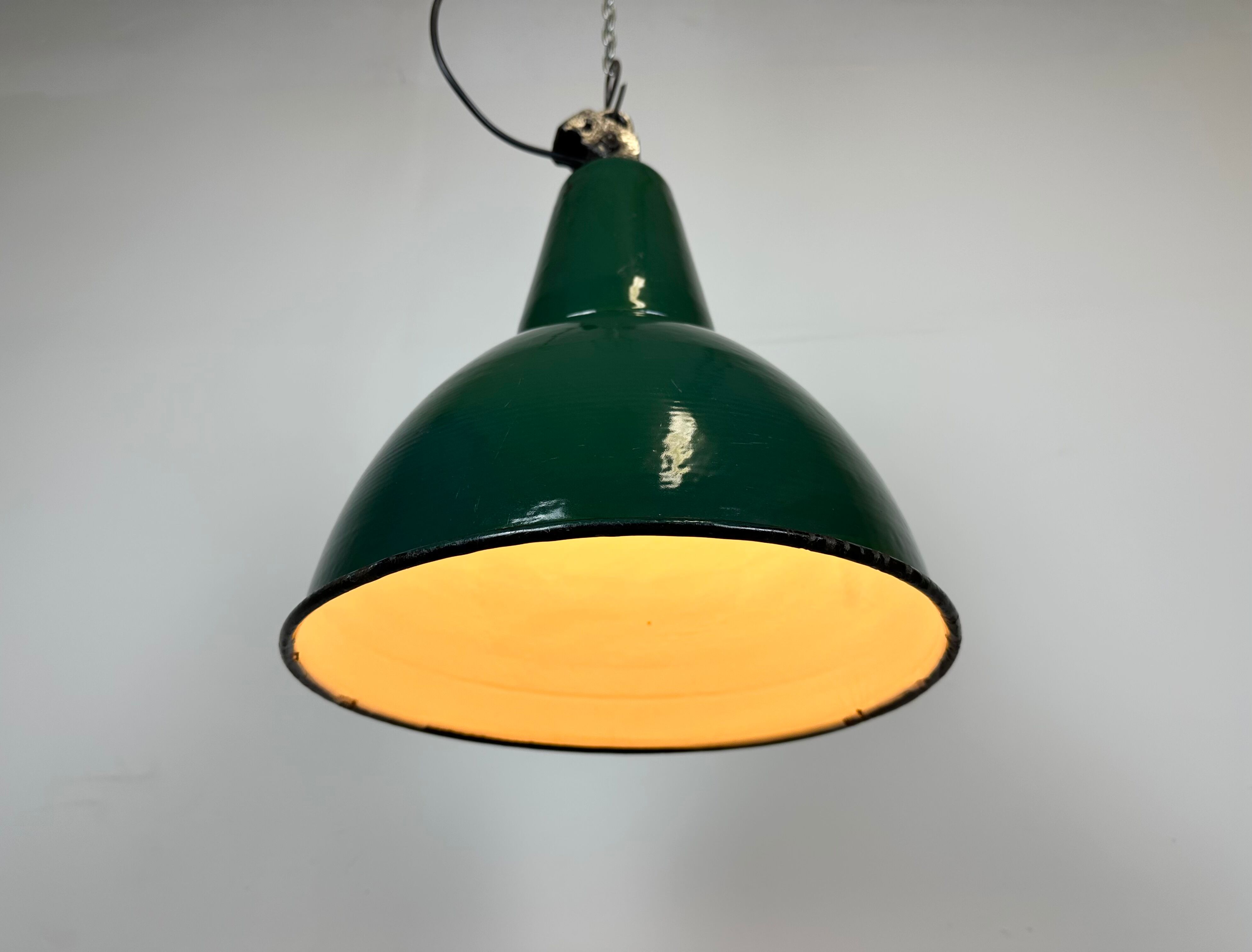 Industrial green enamel factory lamp with cast iron top, 1960s