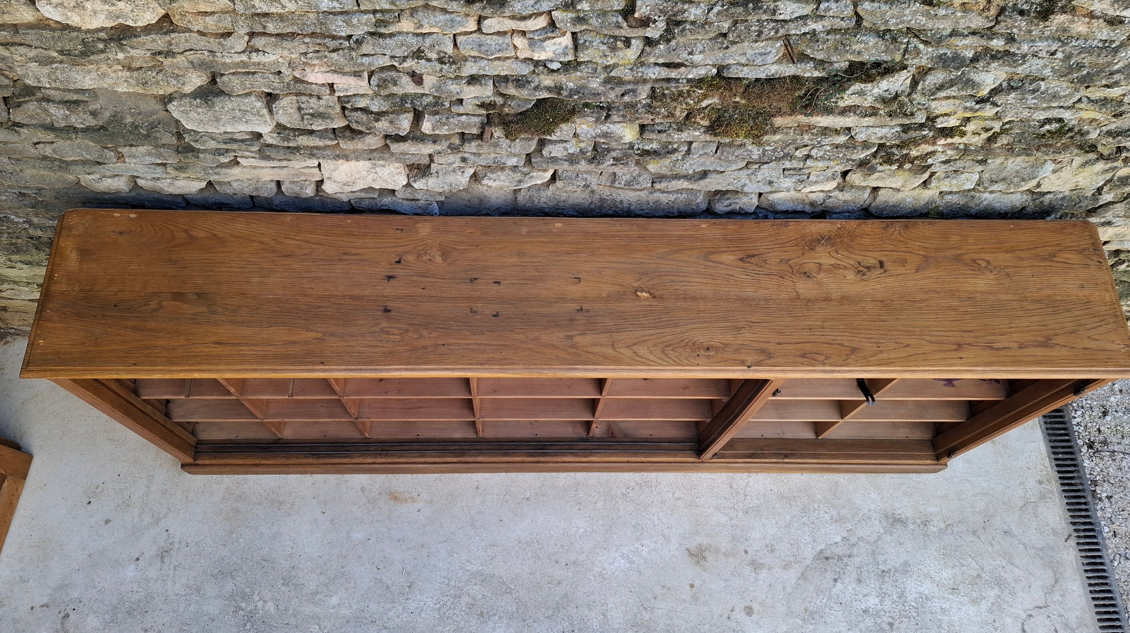 Oak workshop furniture with sliding doors.
