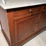 Antique wood and marble kitchen sideboard with carved backsplash