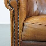 Sheep leather club chair in a cognac color with patina