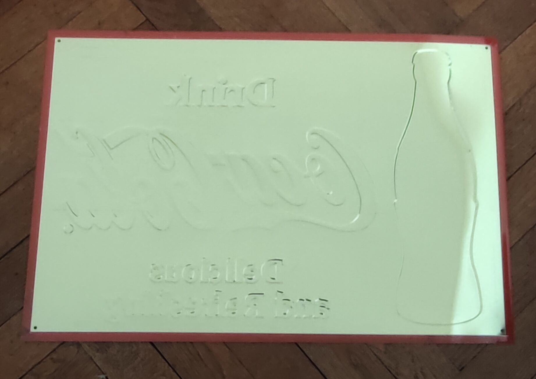 Vintage Coca Cola advertising plaque