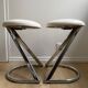 Pair of vintage Z low stools with chrome metal base and white skai seat. H: 49 cm 80s