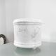 Vintage tripod cache-pot in glazed earthenware with a bubble decoration.