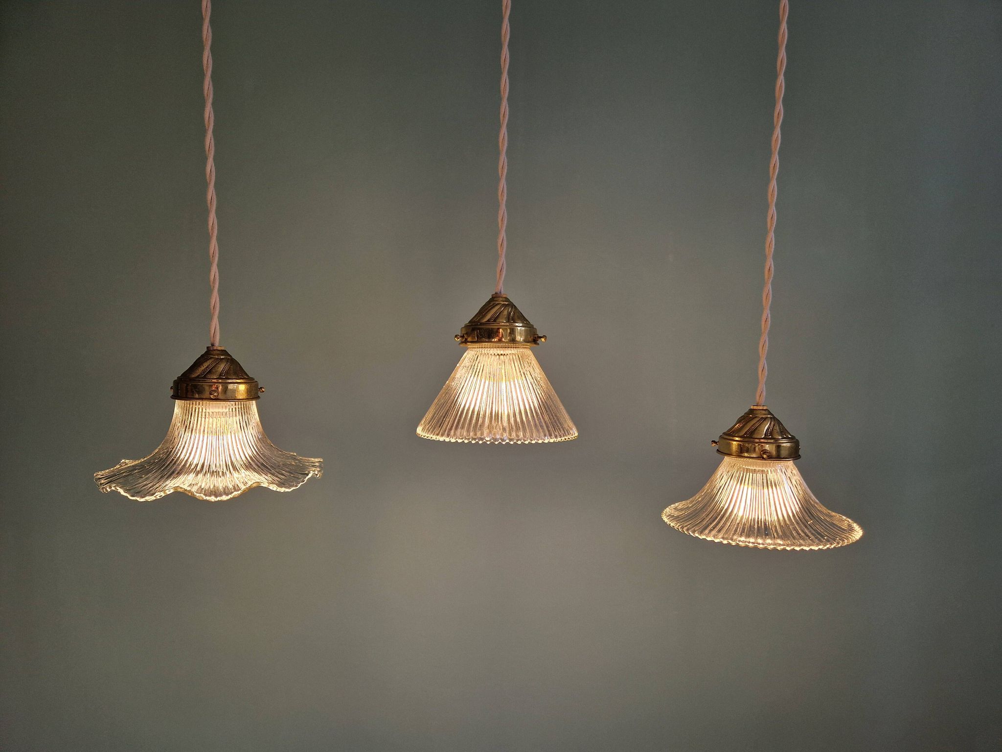 Trio of Art Deco grooved glass pendant lights, 1920s-30s