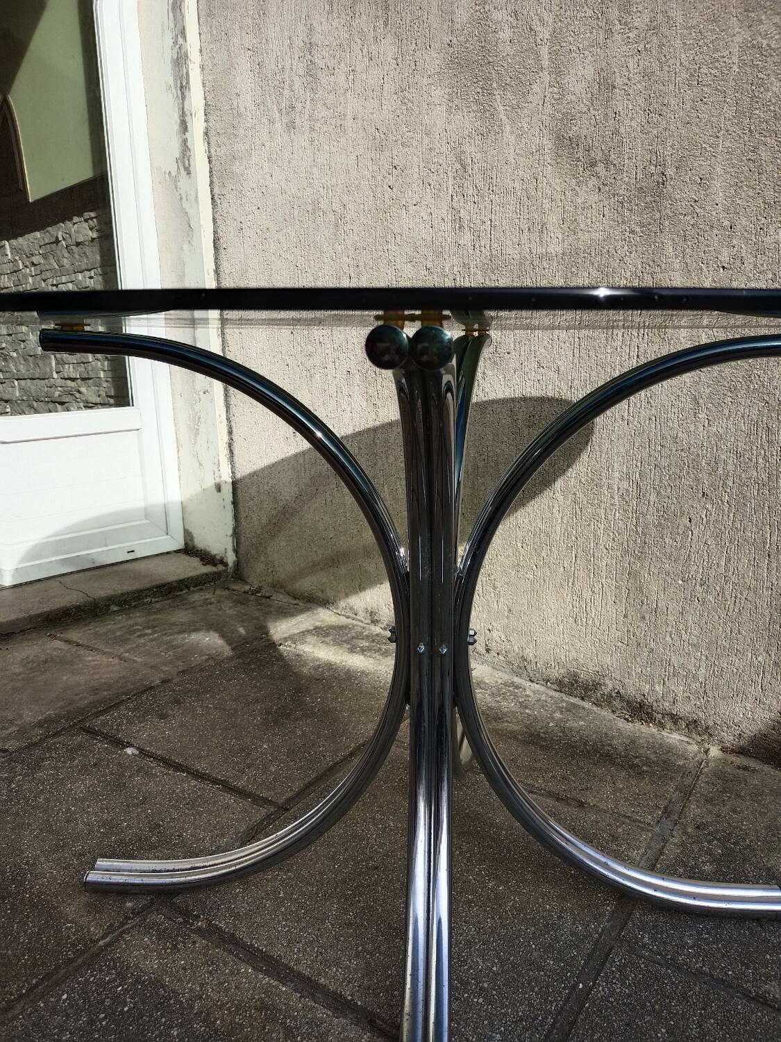 Chromed metal and smoked glass table