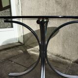 Chromed metal and smoked glass table