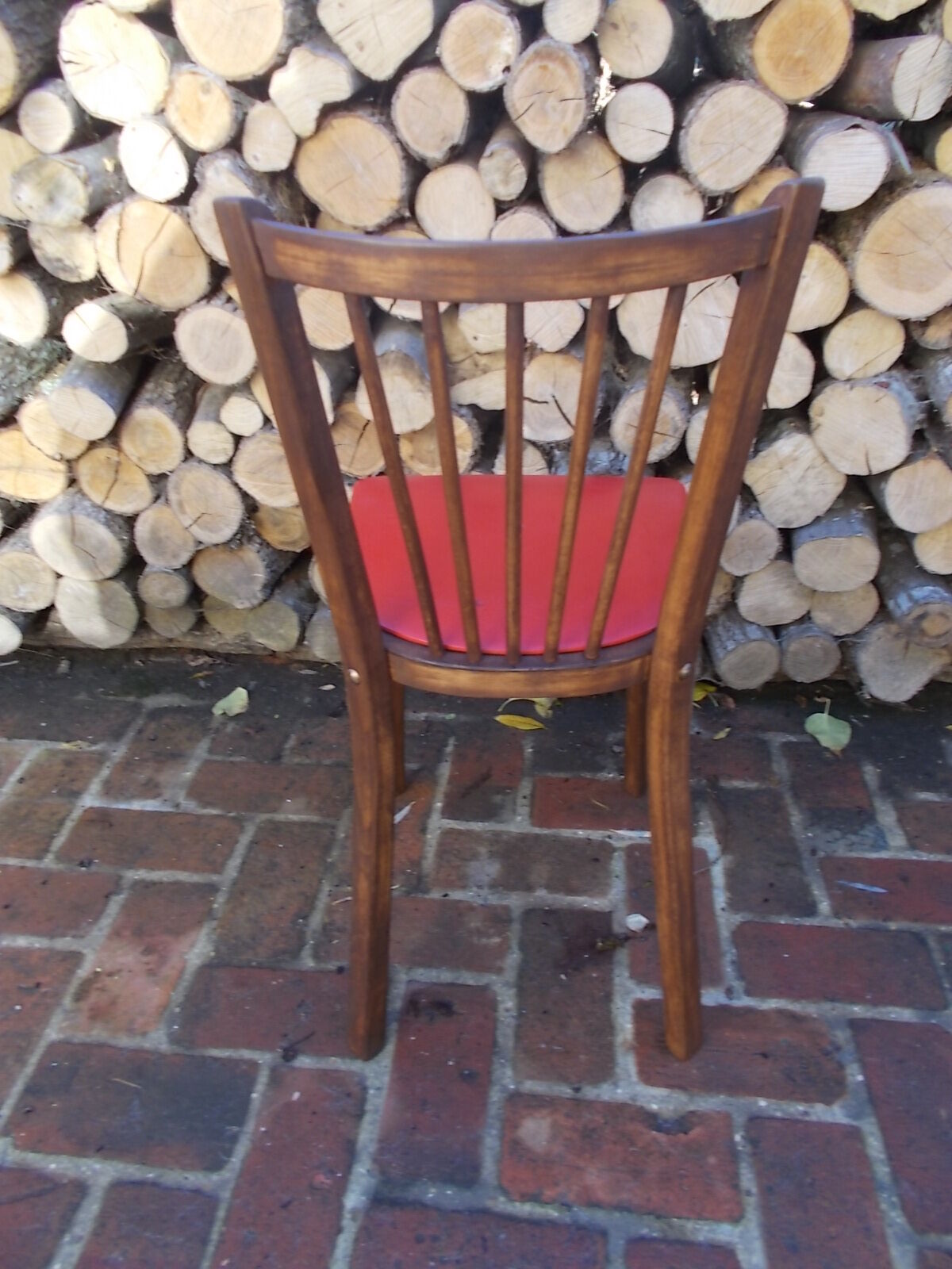 Vintage bistro chair sitting red