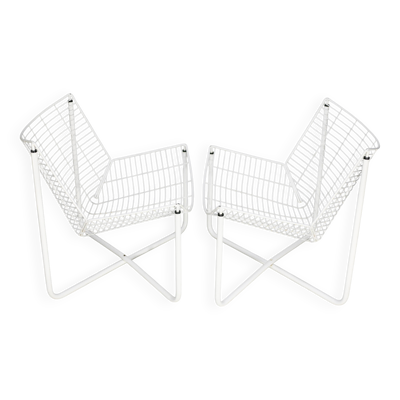 Paire de fauteuils tiges d'acier laqués blanc. Circa 1985