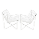 Paire de fauteuils tiges d'acier laqués blanc. Circa 1985