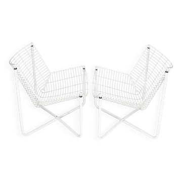 Pair of white lacquered steel rod armchairs. Circa 1985