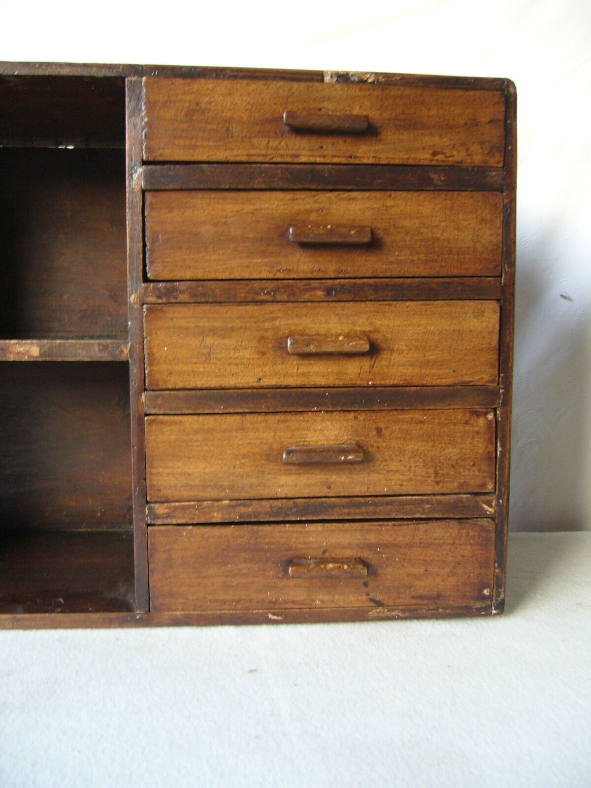 Antique, artisanal seven-drawer furniture