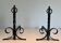 Pair of Neoclassical Fire Dogs in Wrought Iron with Twisted Columns, Finials