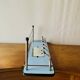 Vintage wall-mounted coat rack in wood and chrome metal with mirror