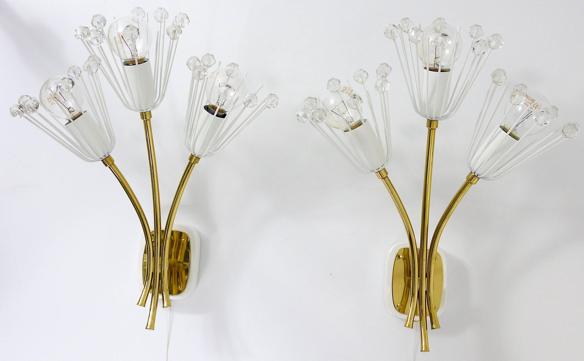 Pair of mid-century wall sconces in brass with flowers, Emil Stejnar, Rupert Nikoll, Austria, 1950s.