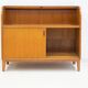 Modern Scandinavian wardrobe in teak with sliding doors and drop-down flap.