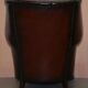 Victorian leather canapé and armchair, barrel back, circa 1860, restored.