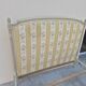 Louis XVI style bed richly decorated in patinated wood.