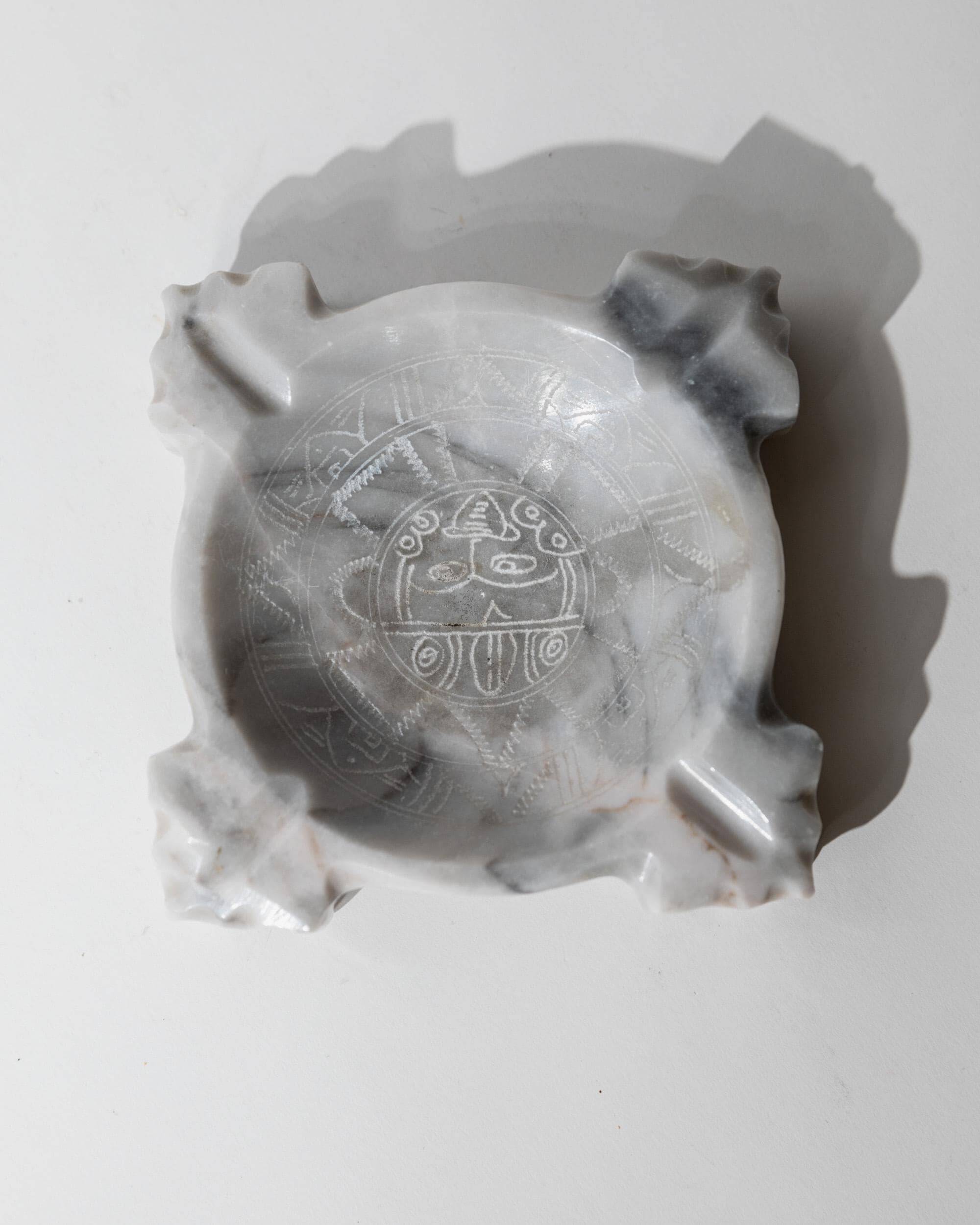 Vintage Mexican marble ashtray from the 1970s, engraved Aztec pattern.