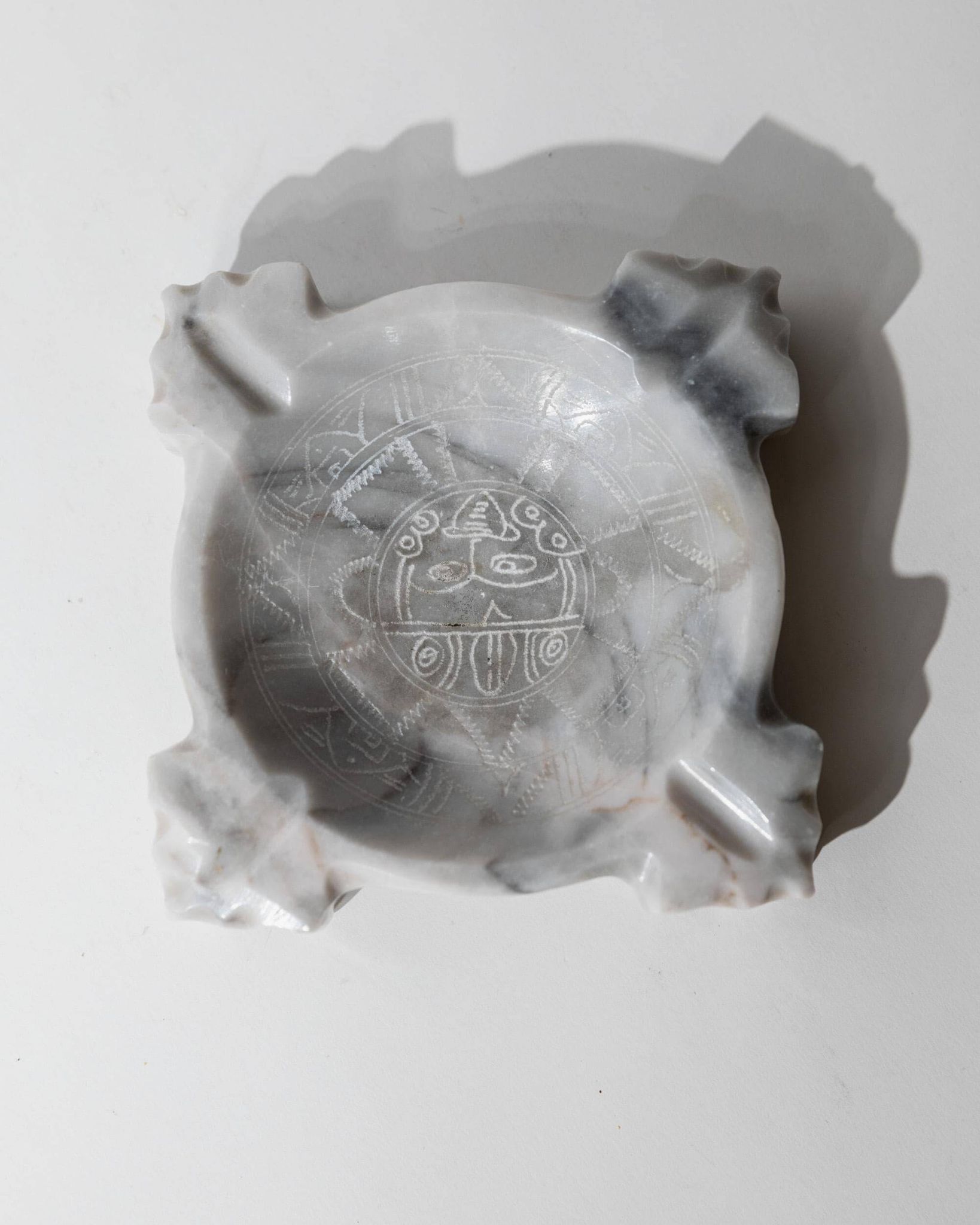 Vintage Mexican marble ashtray from the 1970s, engraved Aztec pattern.