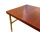 Scandinavian coffee table in teak and brass.