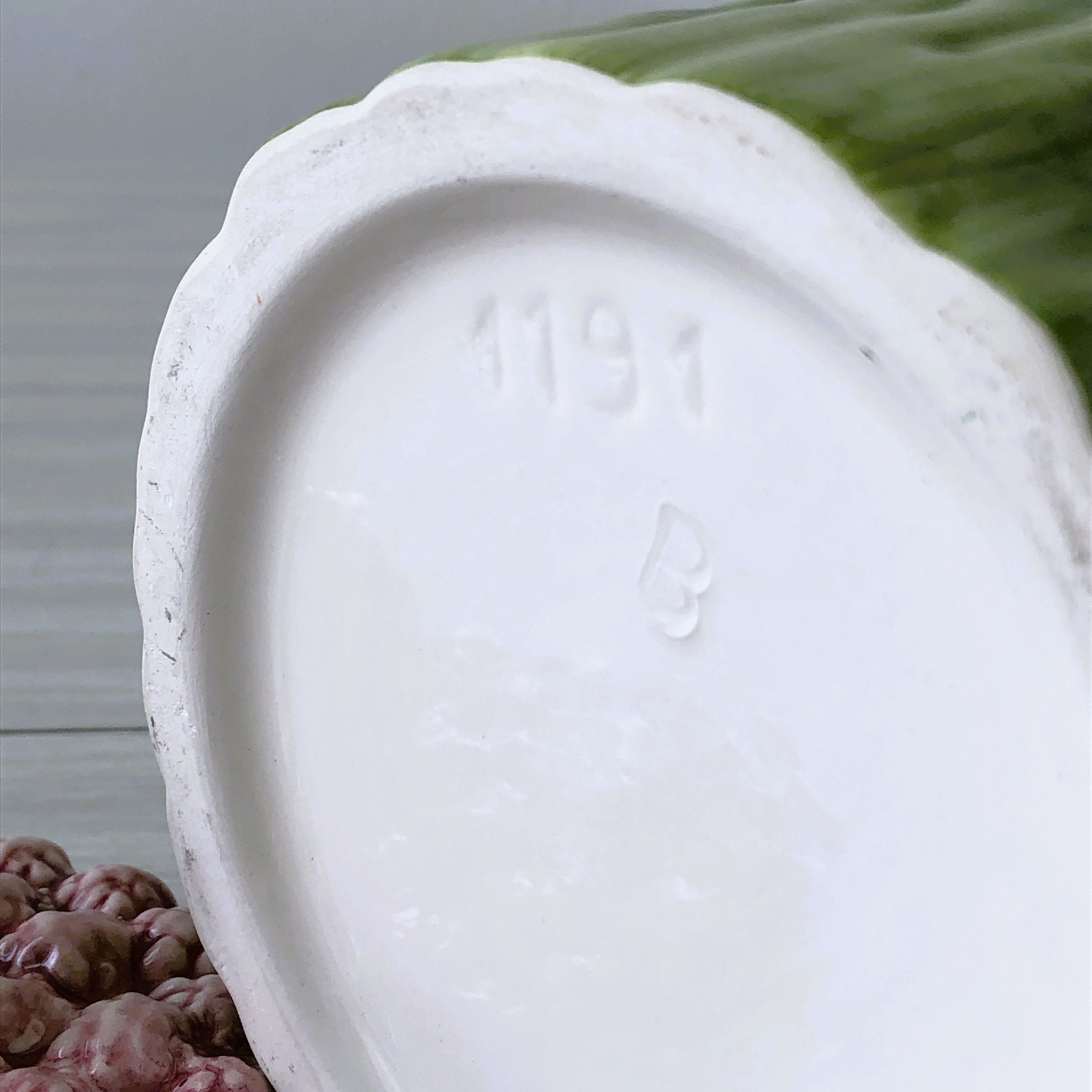 Old mustard pot and its slid in slurry decoration bunch of asparagus.