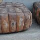 Set of 2 vintage ottomans in brown and black leather with Egyptian patterns from the 1970s.