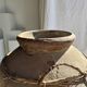 Very large grey and red terracotta pot with handles and rattan crossbars.