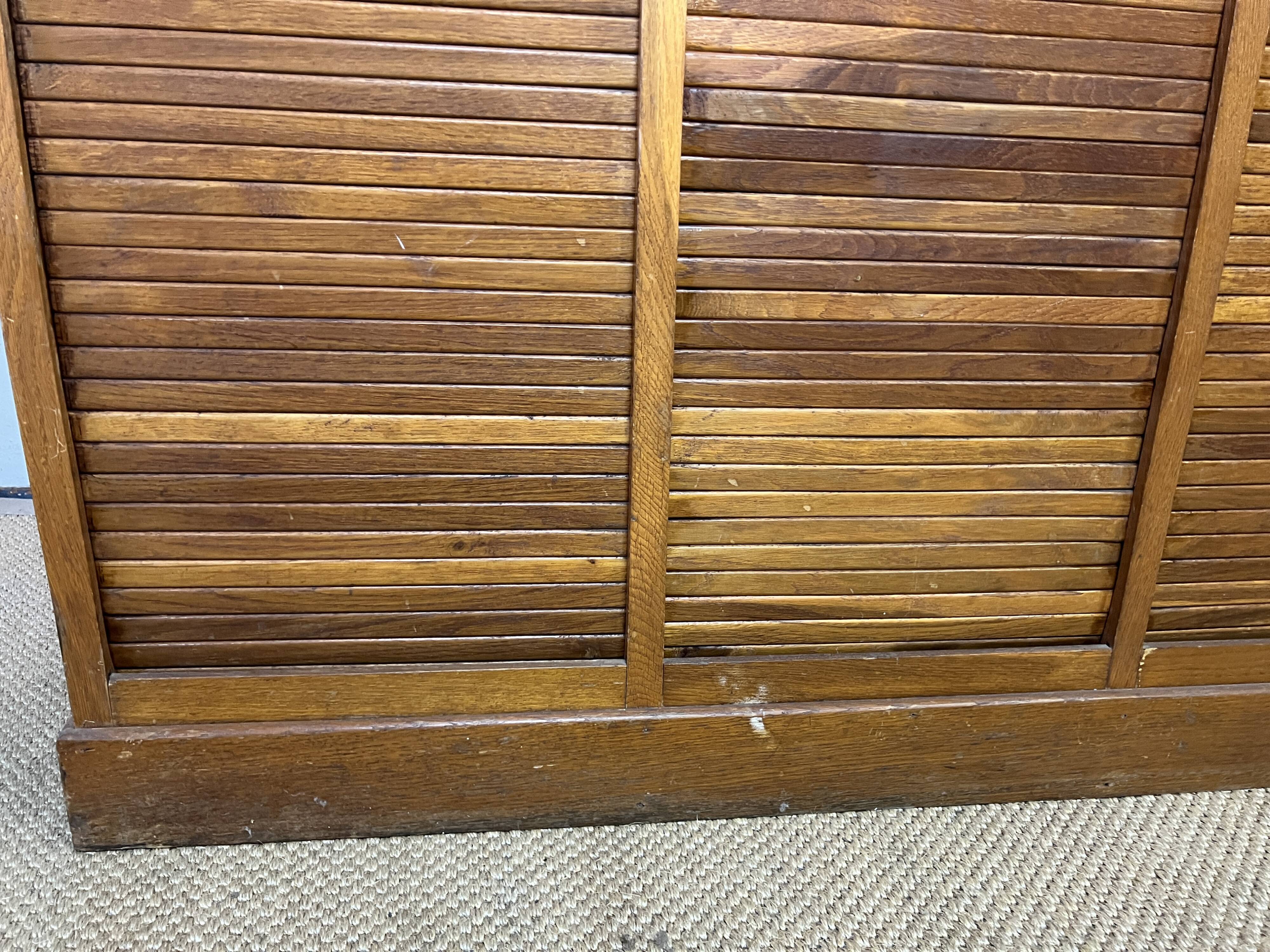 Old filing cabinet with triple curtains