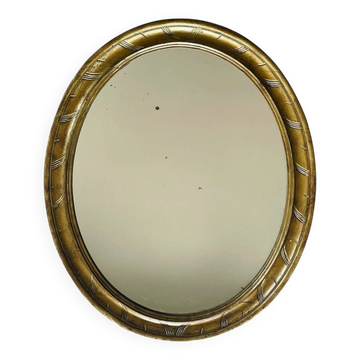 Miroir en bois doré patiné 58cm