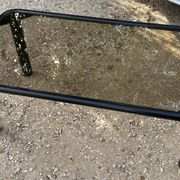 Vintage black tubular coffee table with smoked glass by Yves Boutboul, 1980.