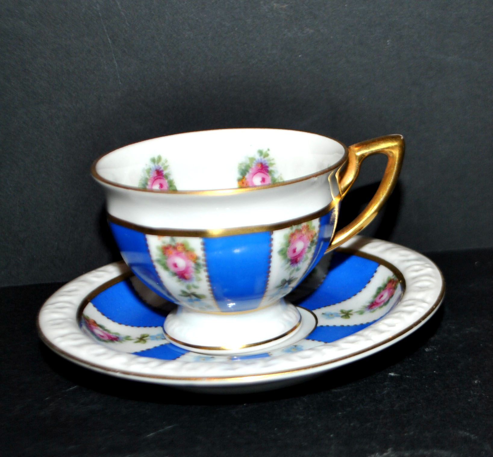Maria collector's cup in blue and gold German porcelain.