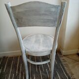 White antique children's chair in patinated wood