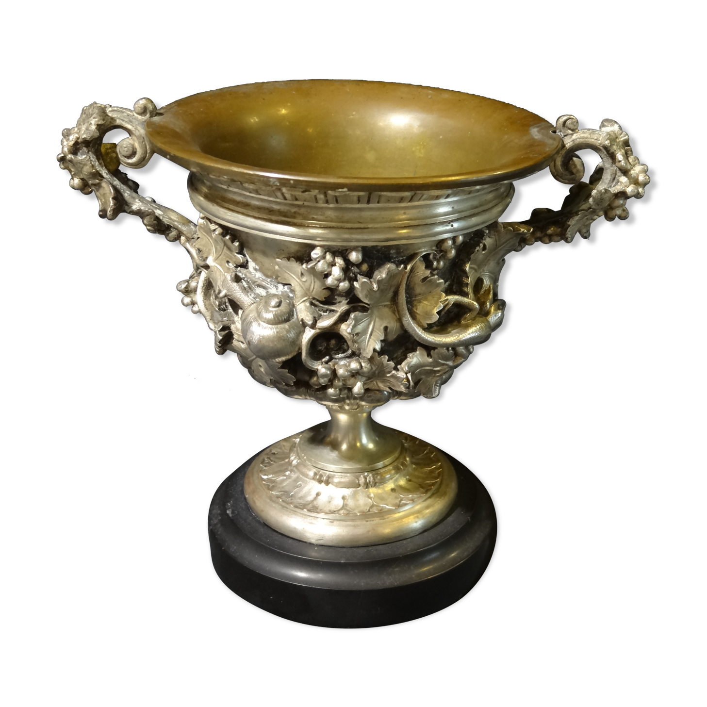 Carved silver bronze vase mounted on marble pedestal
