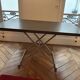 Table that can be transformed into a coffee table with 2 height settings