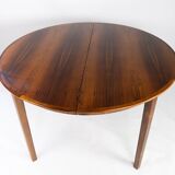 Dining table in rosewood with three extension plates, of danish design from the 1960s.