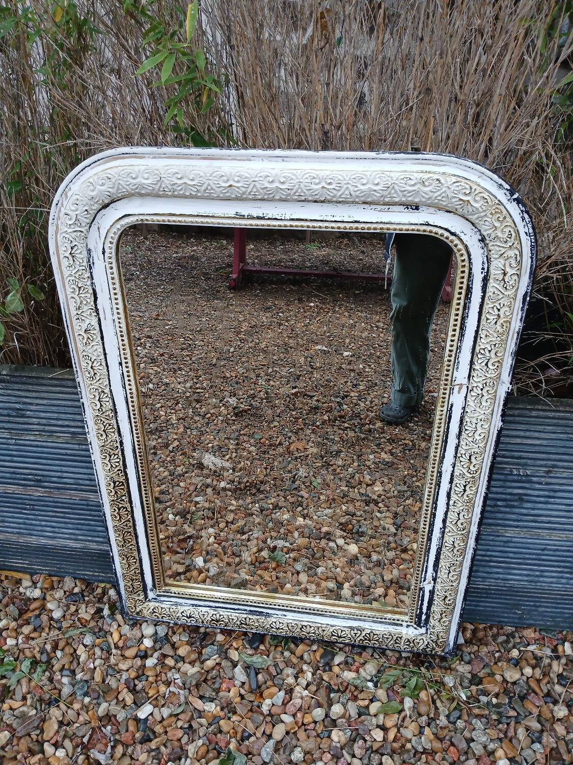 Antique mirror with carved wooden frame