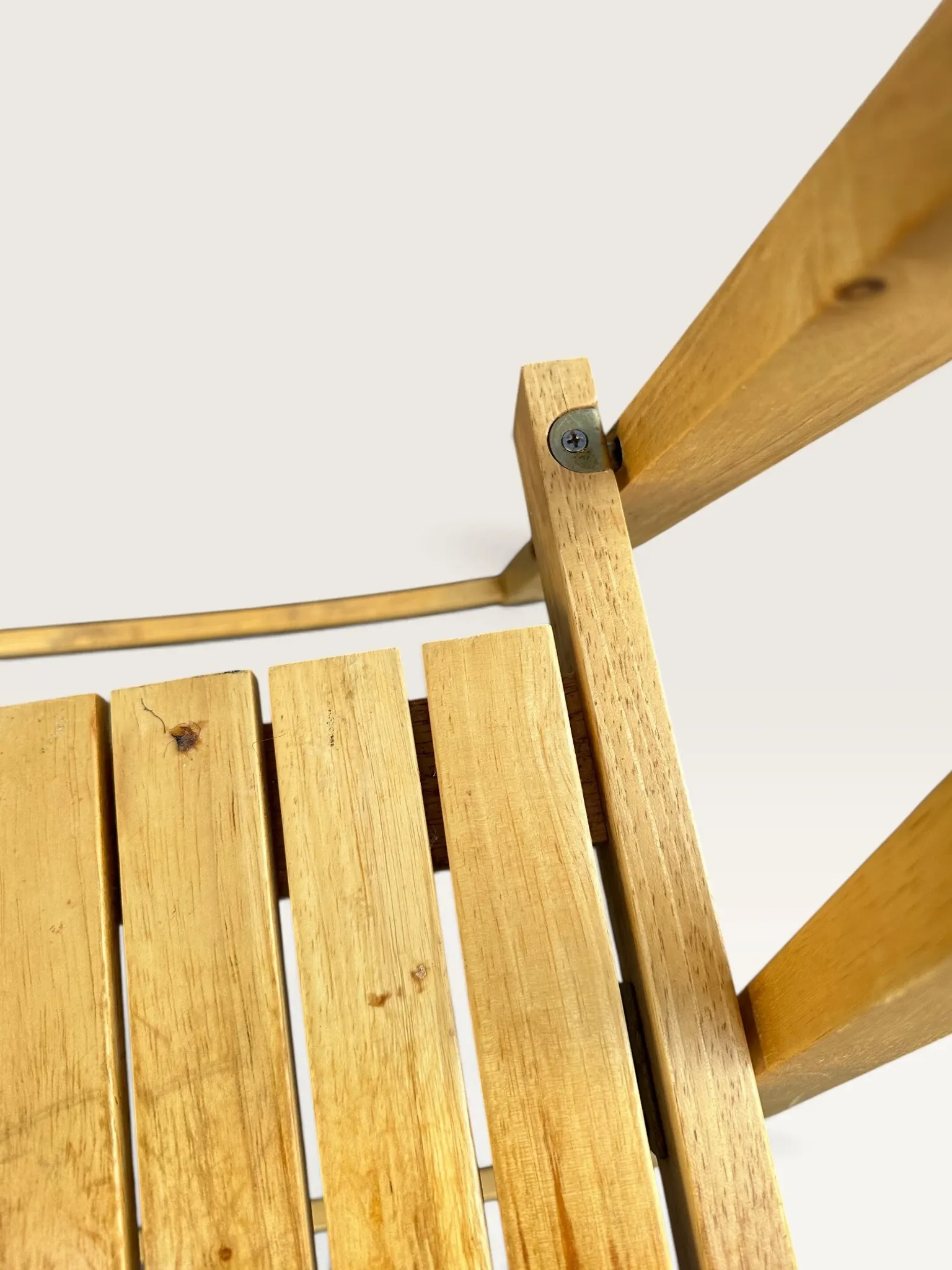 Blonde wooden folding chair in the style of Aldo Jacober.
