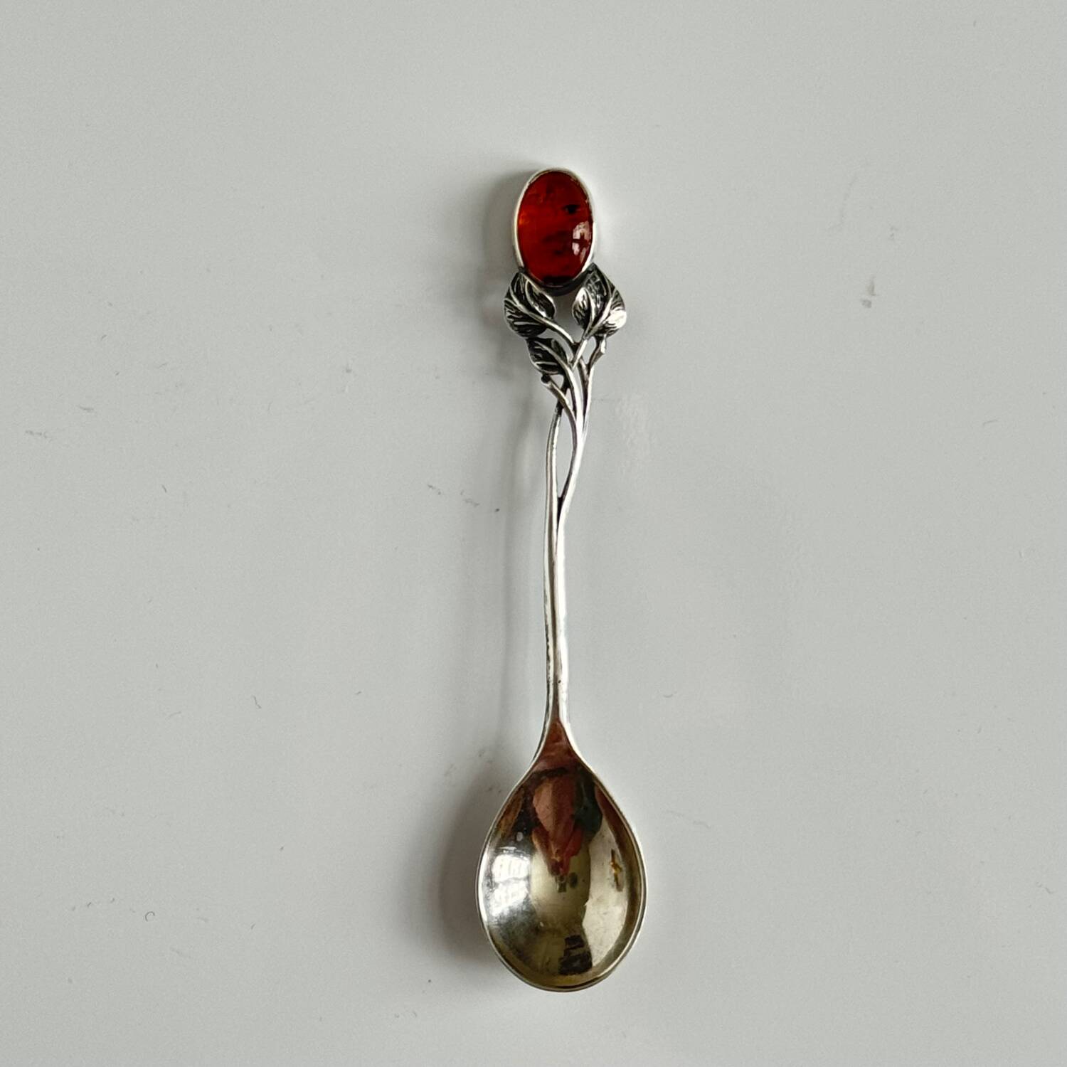 Silver spoon with amber