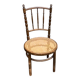 Vintage 19th-century bistro chair made of curved solid wood and caned in the Thonet style.