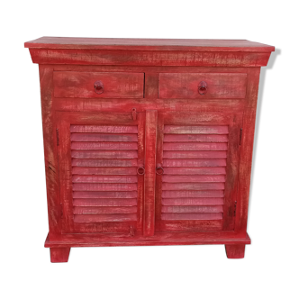 Red wooden dresser with a door and two drawers