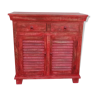 Red wooden dresser with a door and two drawers